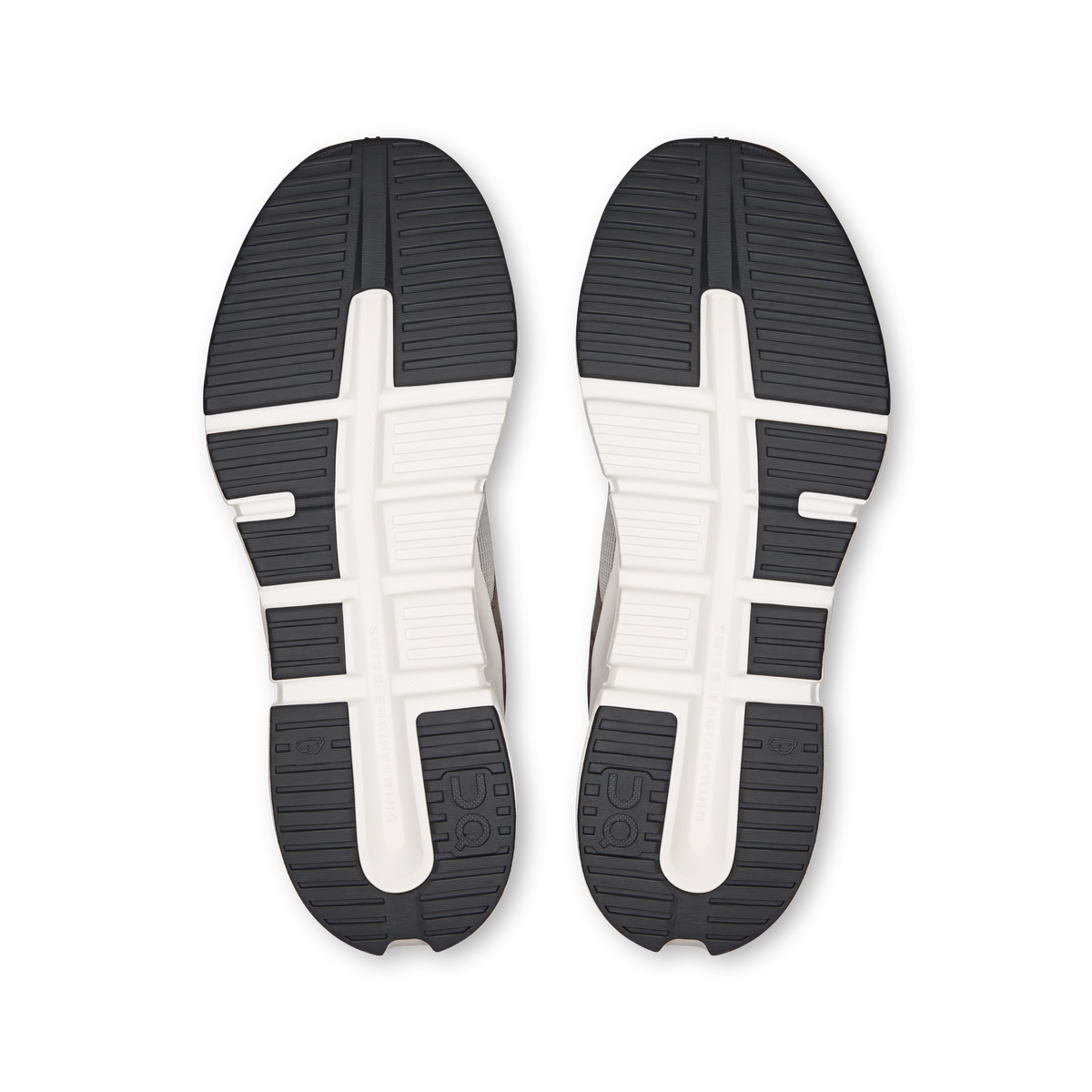 Shoe outsoles with dark rubber tread, white midsole and side traction grooves