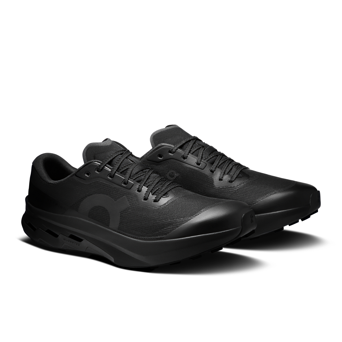 Men's On running shoes in black, angled side view with laces and molded heel