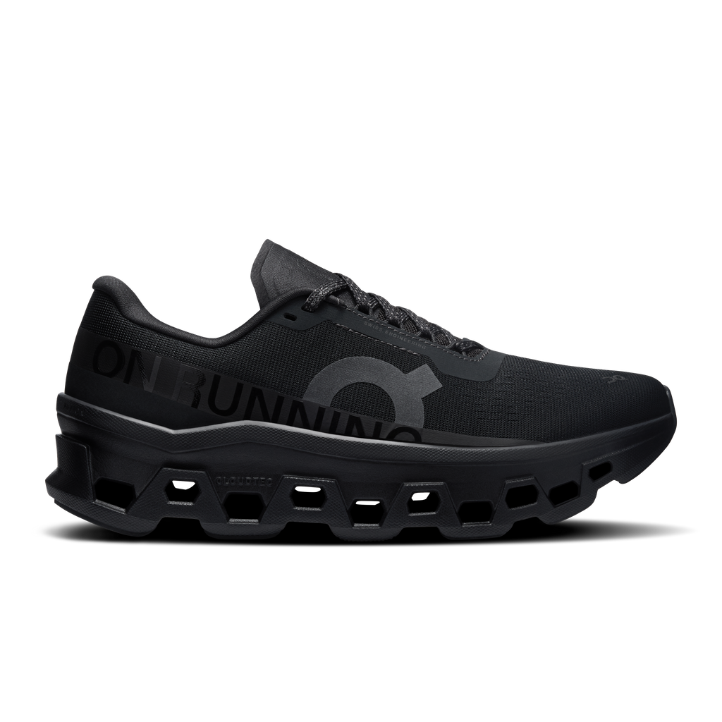 On Cloudmonster 1 women's black running shoes, lace-up side view with mesh upper.