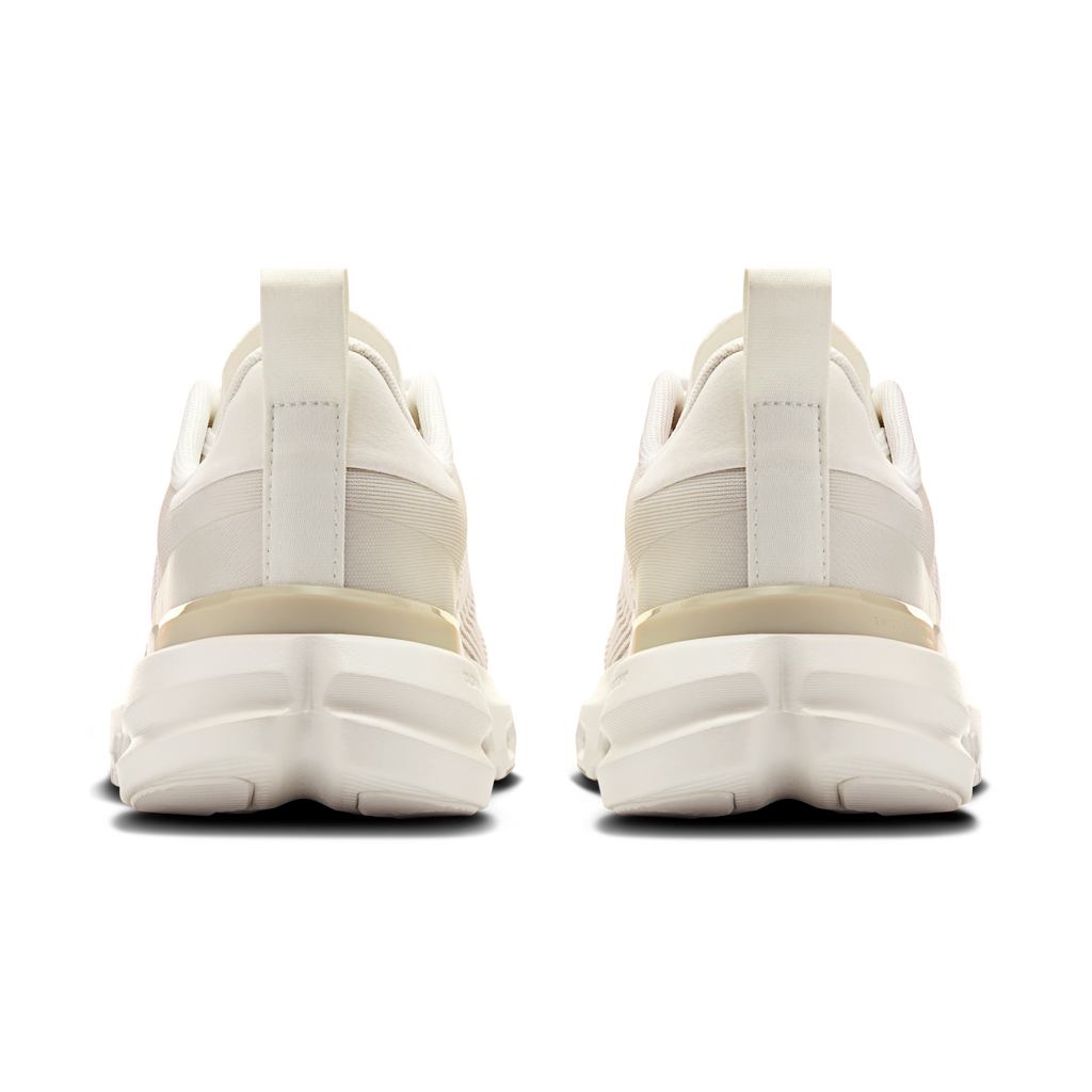 Men's running shoe heel view in white with padded collar and cushioned sole pods