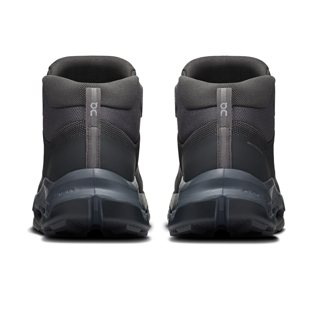 Men's waterproof mid hiking shoes by On, back view with heel pull tab and cushioned collar