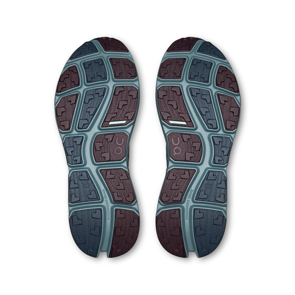 Pair of shoe outsoles with geometric tread in blue and maroon rubber sections