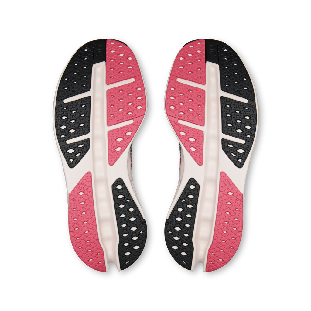 Shoe outsoles pair, black and pink tread with white center pods