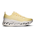 Women's yellow running shoes with white cushioned sole and black cutout pods