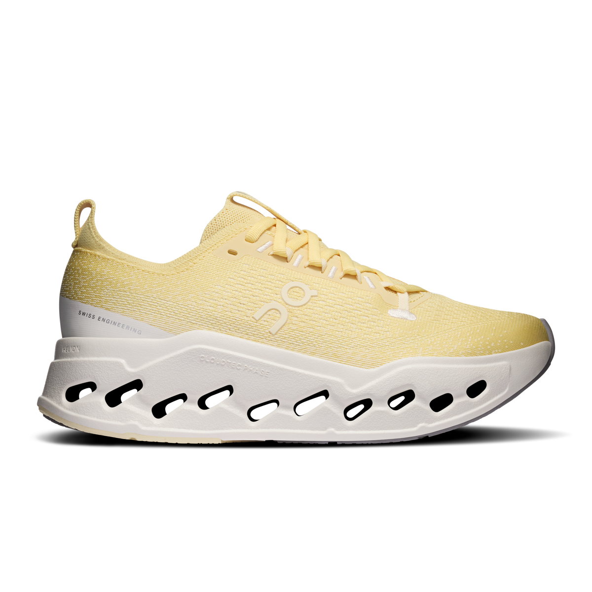 Women's yellow running shoes with white cushioned sole and black cutout pods