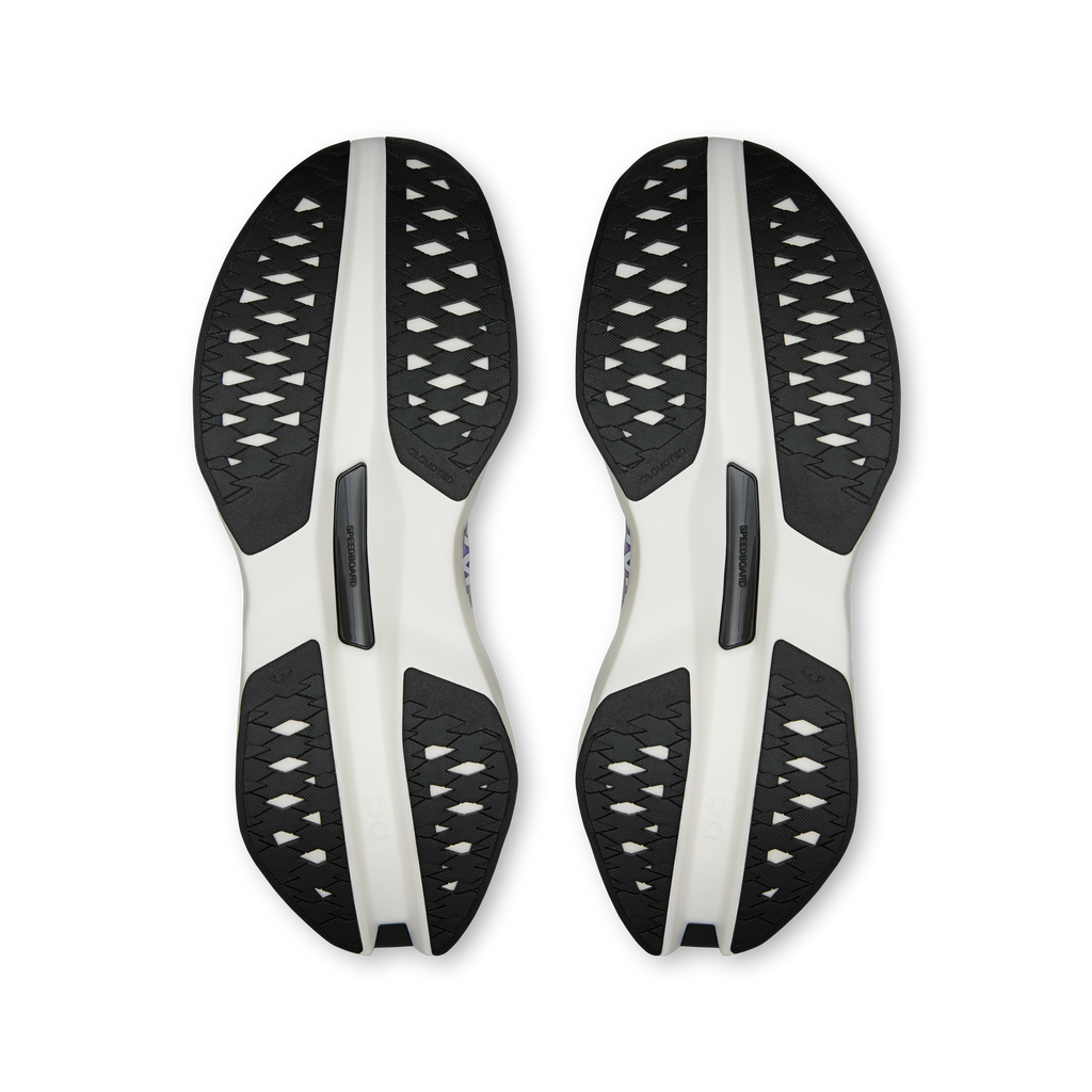 Men's running shoe outsoles, textured tread with white and black rubber pods