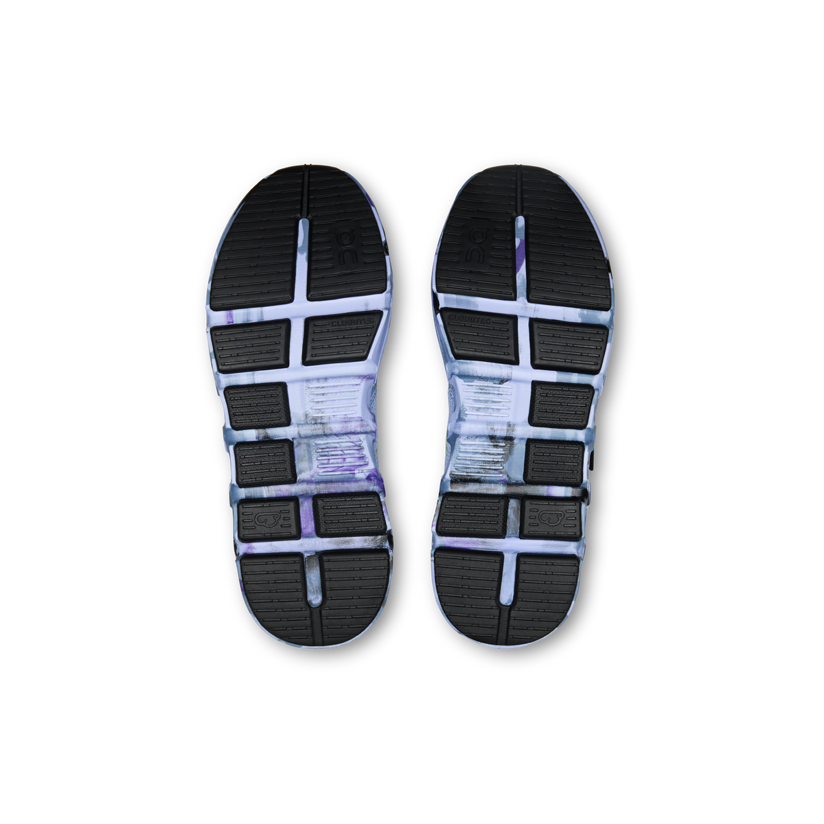 Kids' sneaker outsoles showing tread and cushioned pods