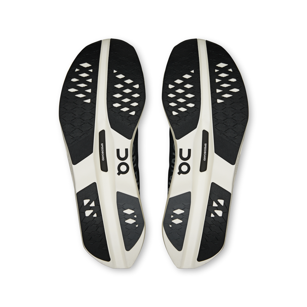 On men's running shoes, pair outsole view with black tread and white side panels