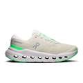Women's running shoes in cream with green accents and cloud-like sole