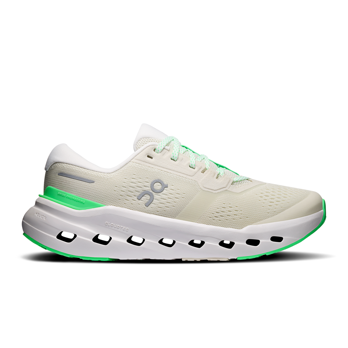 Women's running shoes in cream with green accents and cloud-like sole