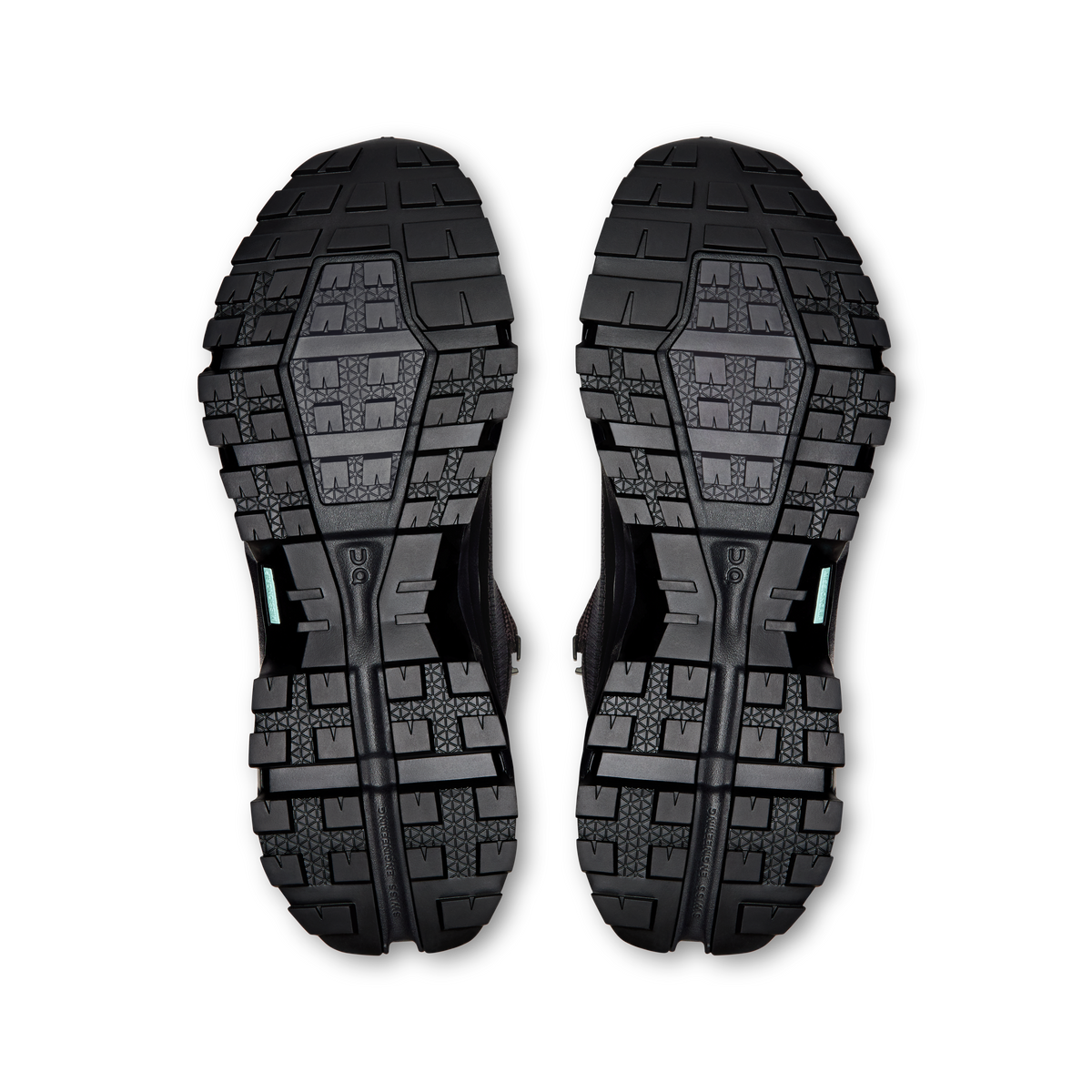 Pair of black rugged outsoles with deep tread pattern