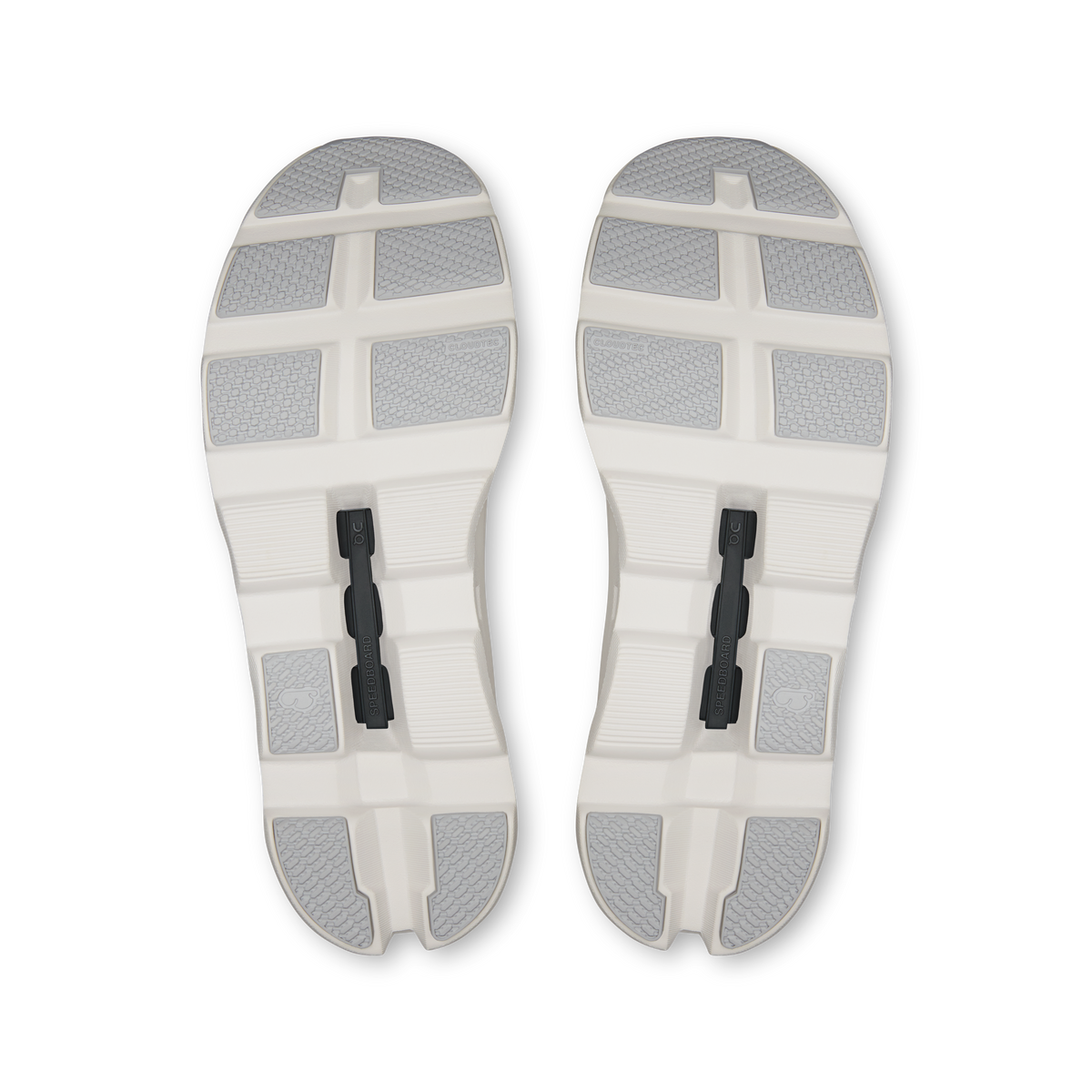 Pair of shoe outsoles in white with gray traction pads and center support