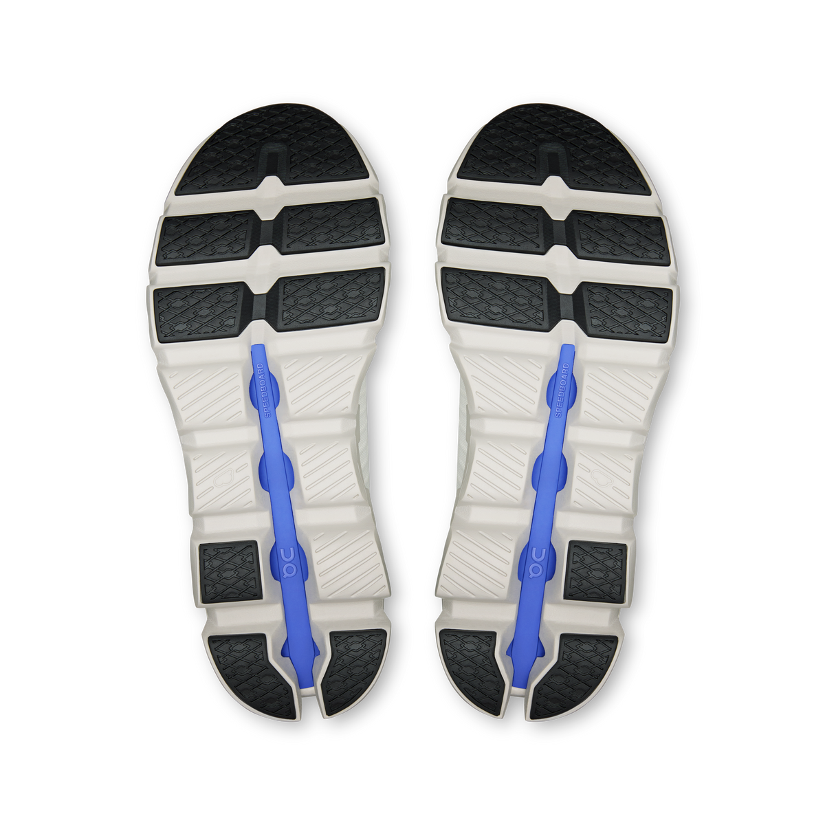 Shoe outsole view with dark tread sections and blue flex post inserts