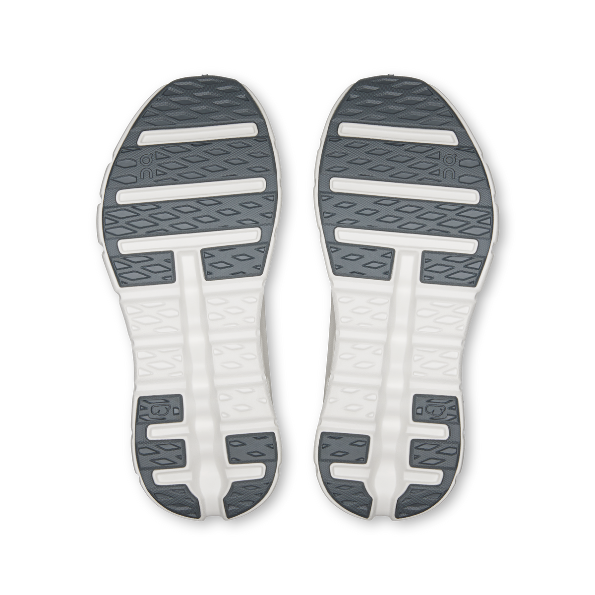 Women’s On running shoe outsoles with gray tread and white cushioning pods