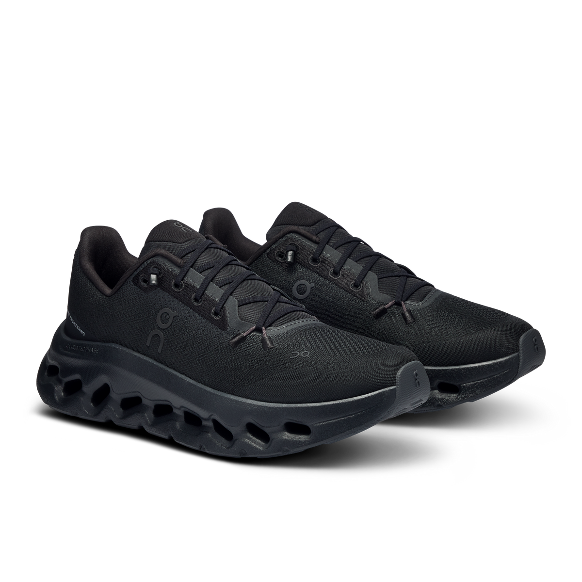 Women's black running shoes, side view with cloud-like perforated outsole