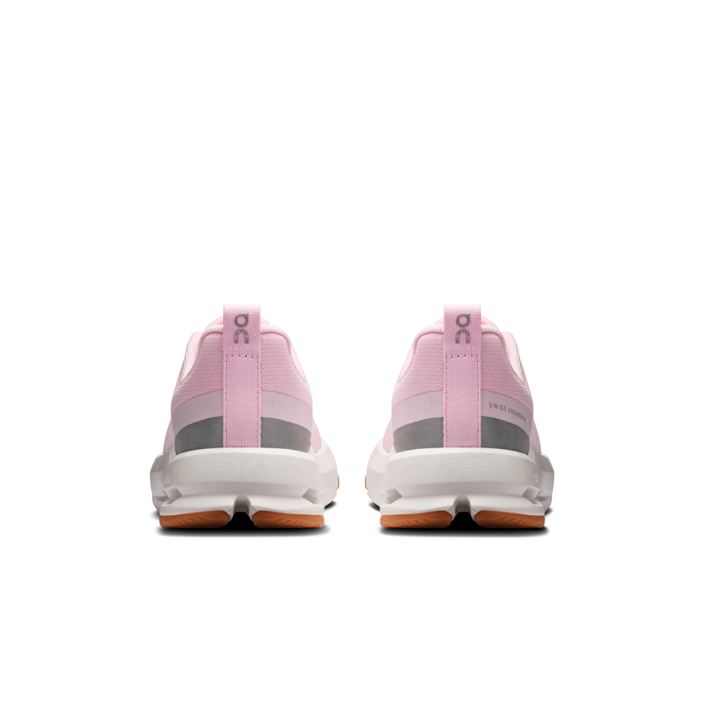 Kids' pink running shoes from back with pull tab and cushioned heel