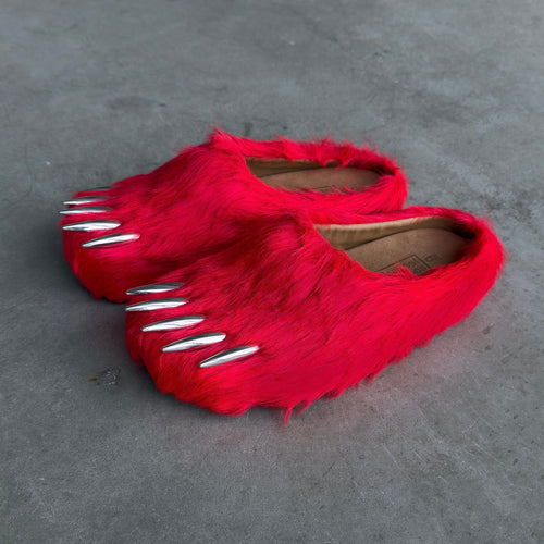 Red faux-fur bear claw mules with open toe and white claw accents on the strap