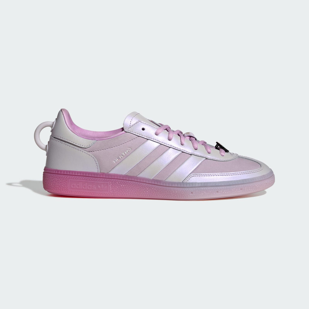 Adidas men’s low-top handball shoes in white and lavender with 3-Stripes and laces