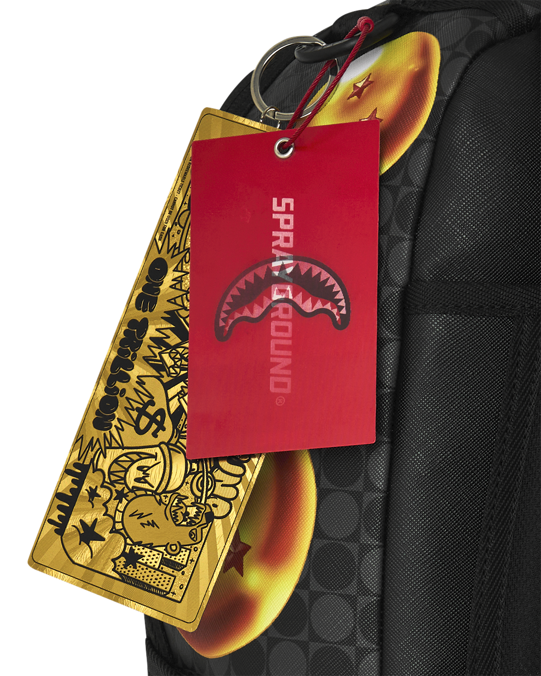 Black backpack with hanging red and yellow hang tags and metal ring attachment