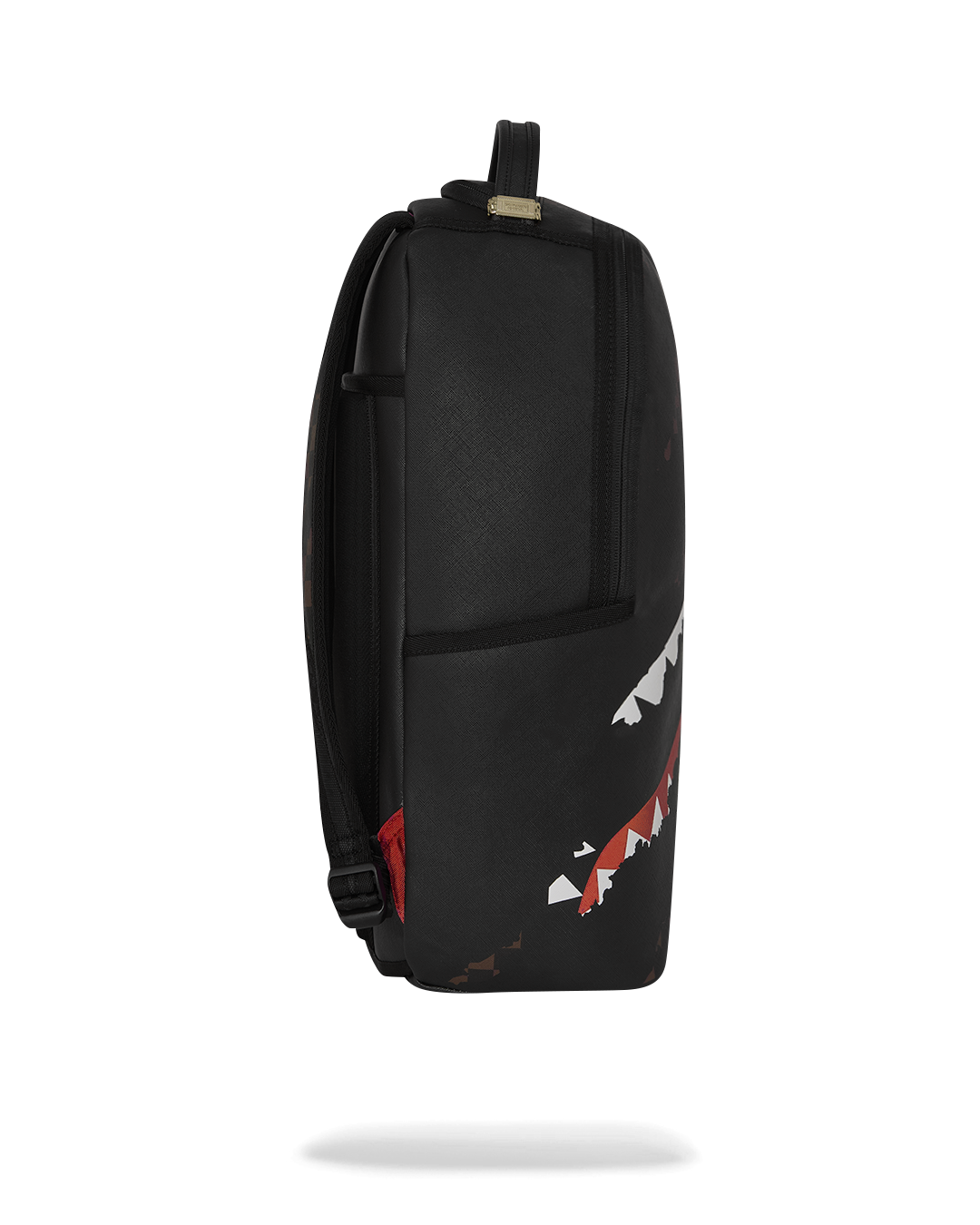 Black backpack back panel with red trim and white shark fin print