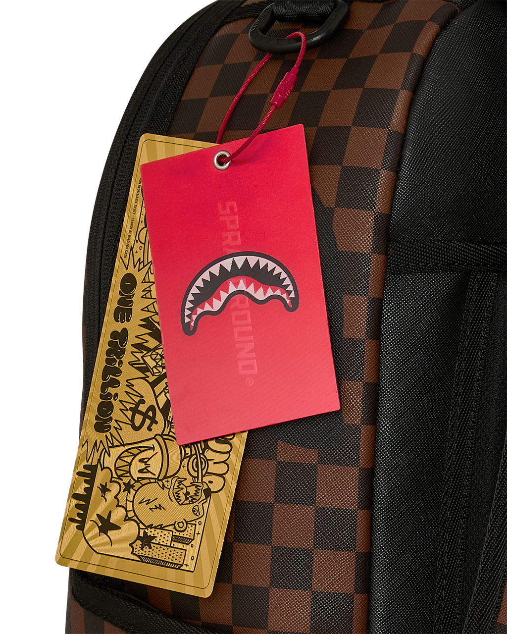 Close-up of backpack side pocket with hanging red and yellow tags