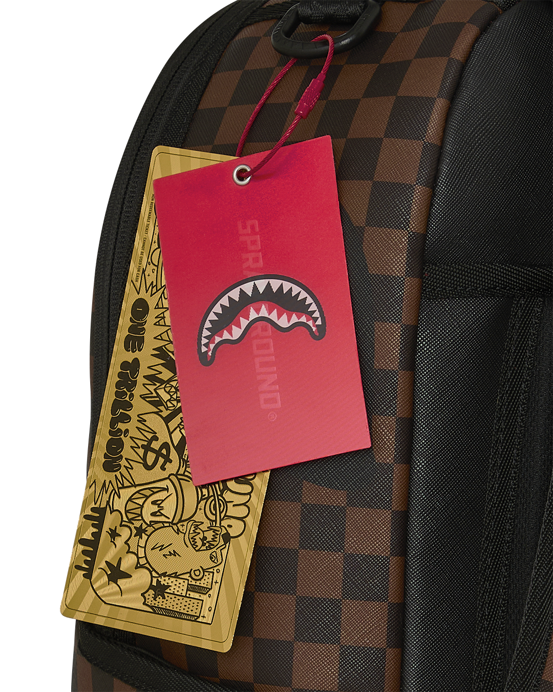 Close-up of backpack side pocket with hanging red and yellow tags