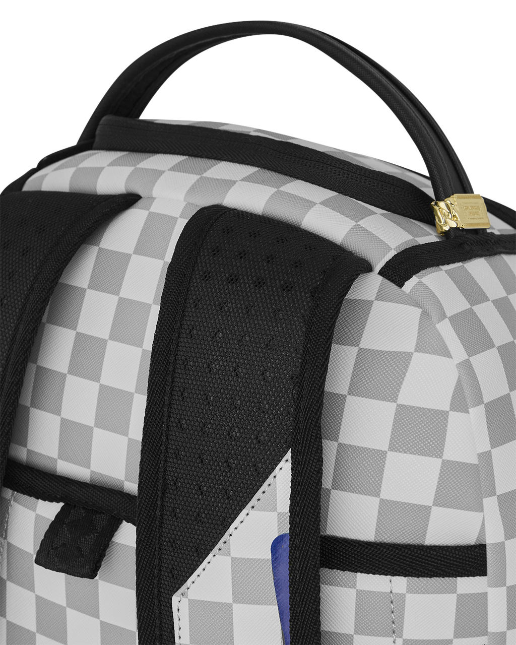 Checkered backpack top with black mesh pocket and gold zipper pull.