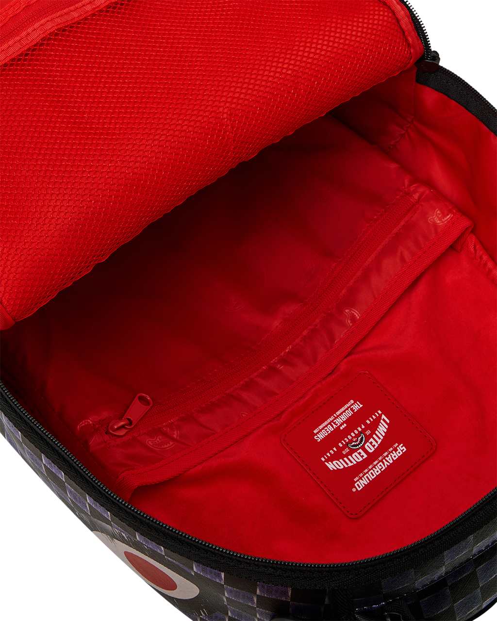 Backpack with red interior lining and zip pocket