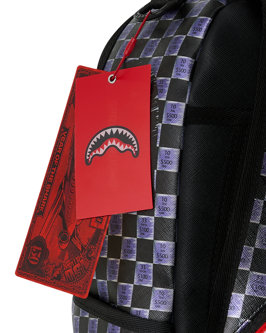 Backpack with checker-print panel and hanging retail tags