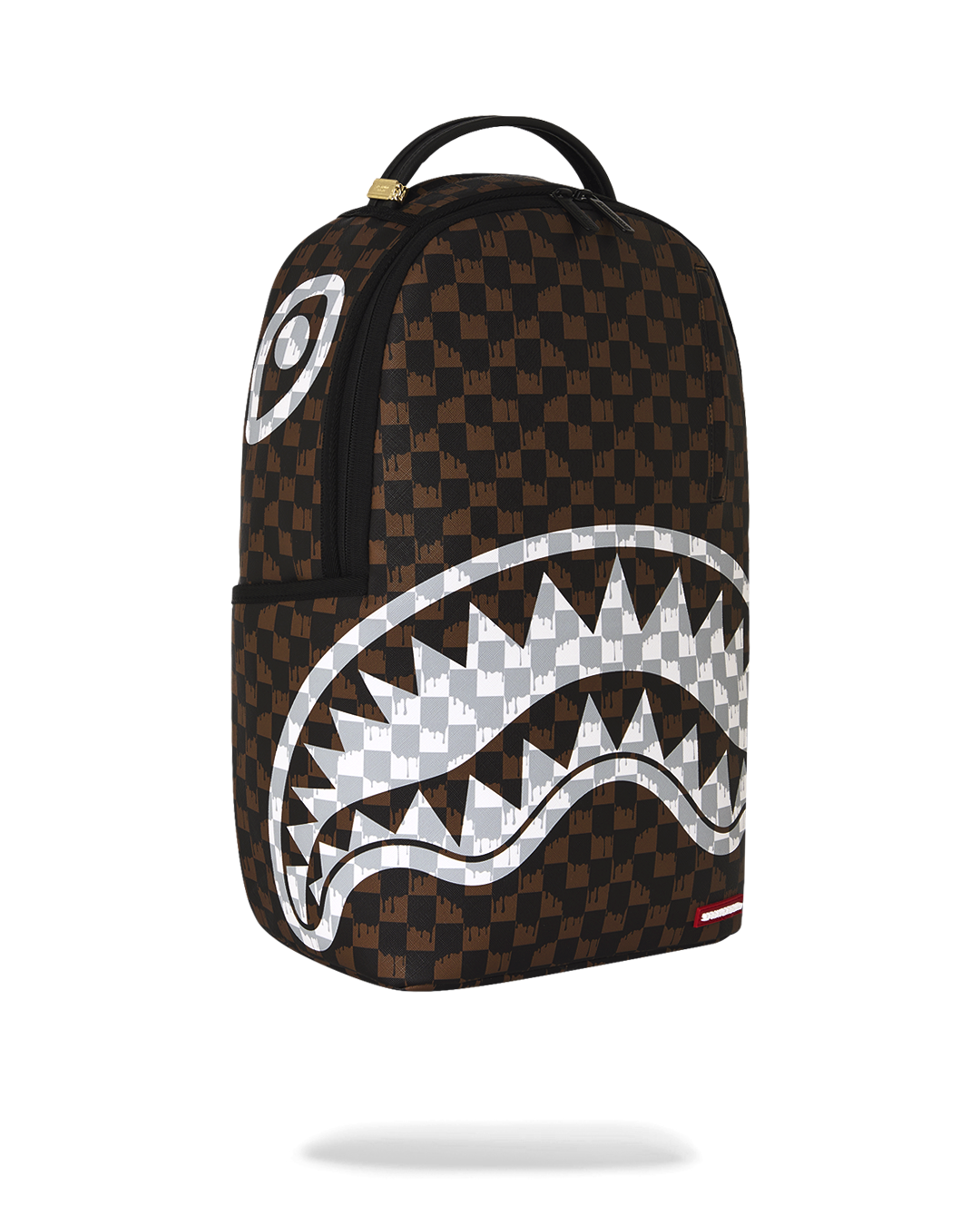 Brown checkered mini backpack with white fang-style graphic and side tag