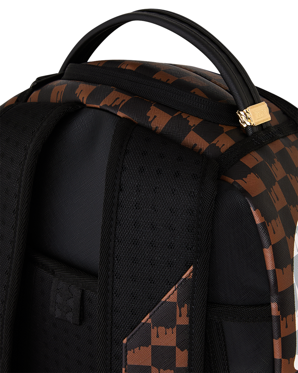 Brown checkered backpack close-up with black front pocket and gold-tone buckle