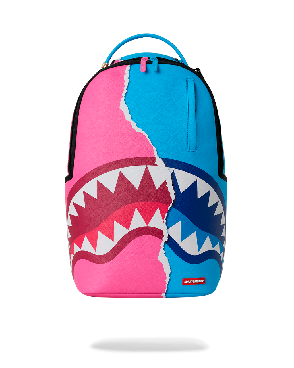 Shark-themed mini backpack with teal, pink, and blue panels and top handle