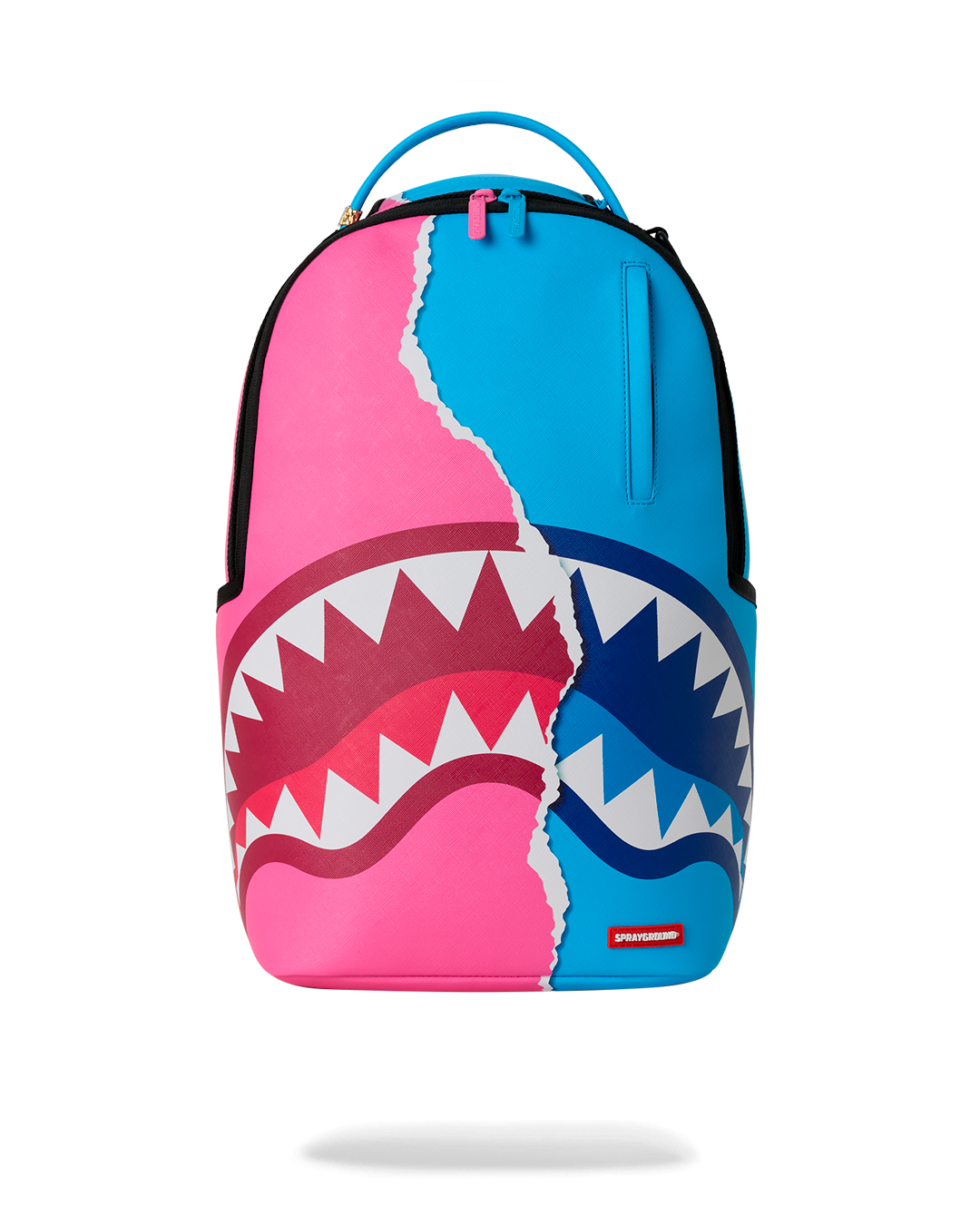 Shark-themed mini backpack with teal, pink, and blue panels and top handle