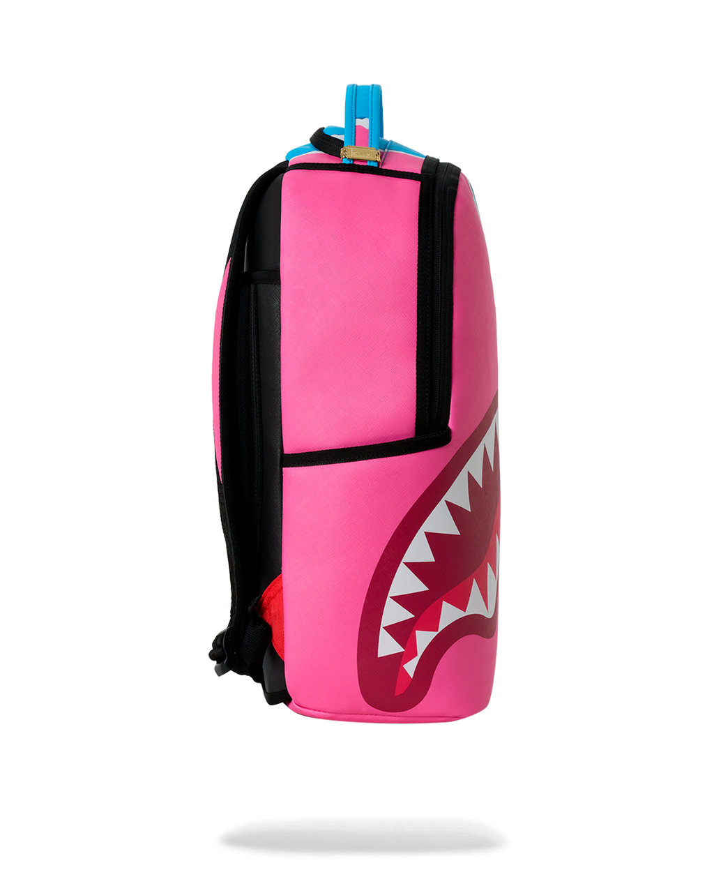 Side view of teal-and-pink shark graphic mini backpack with black trim