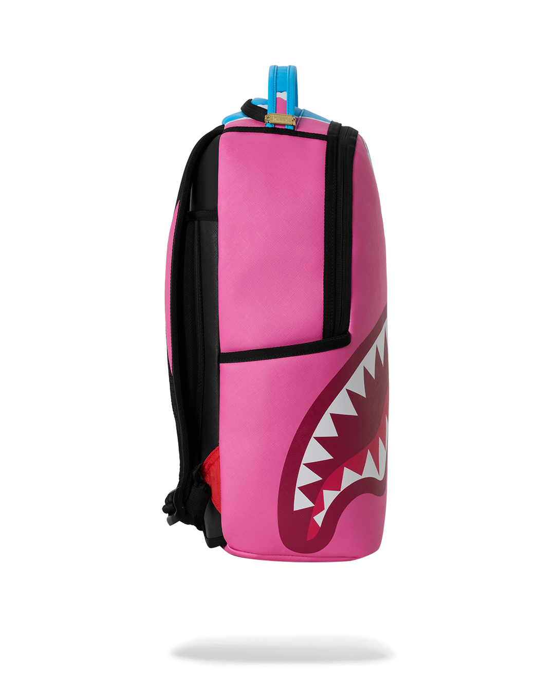 Side view of teal-and-pink shark graphic mini backpack with black trim