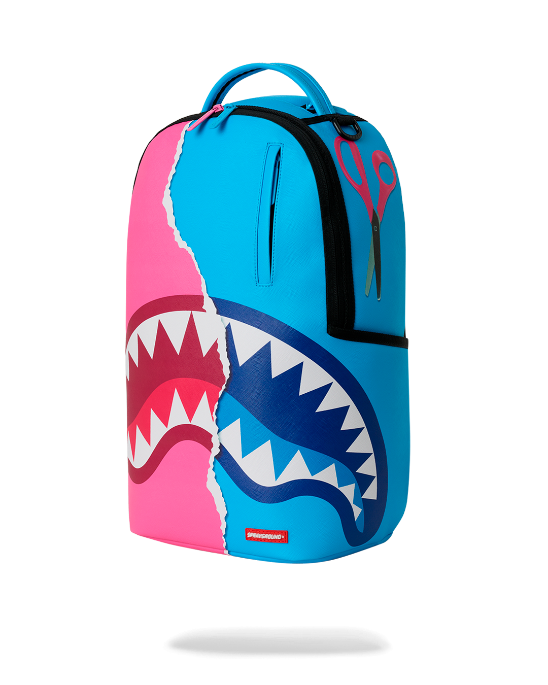 Three-quarter view of teal-and-pink shark graphic mini backpack with top handle