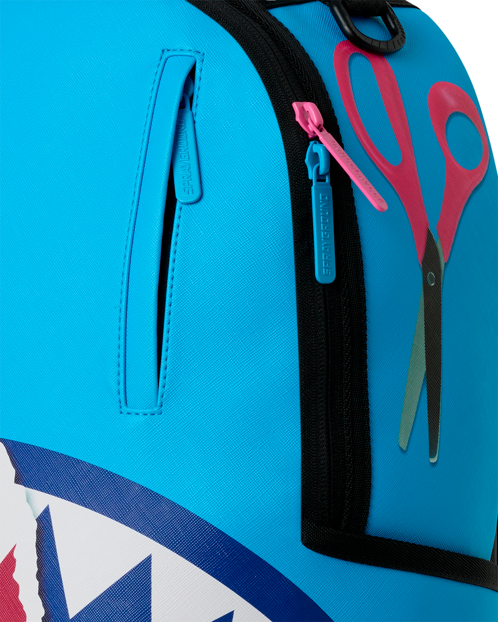 Close-up of teal front pocket and zipper on shark-themed mini backpack