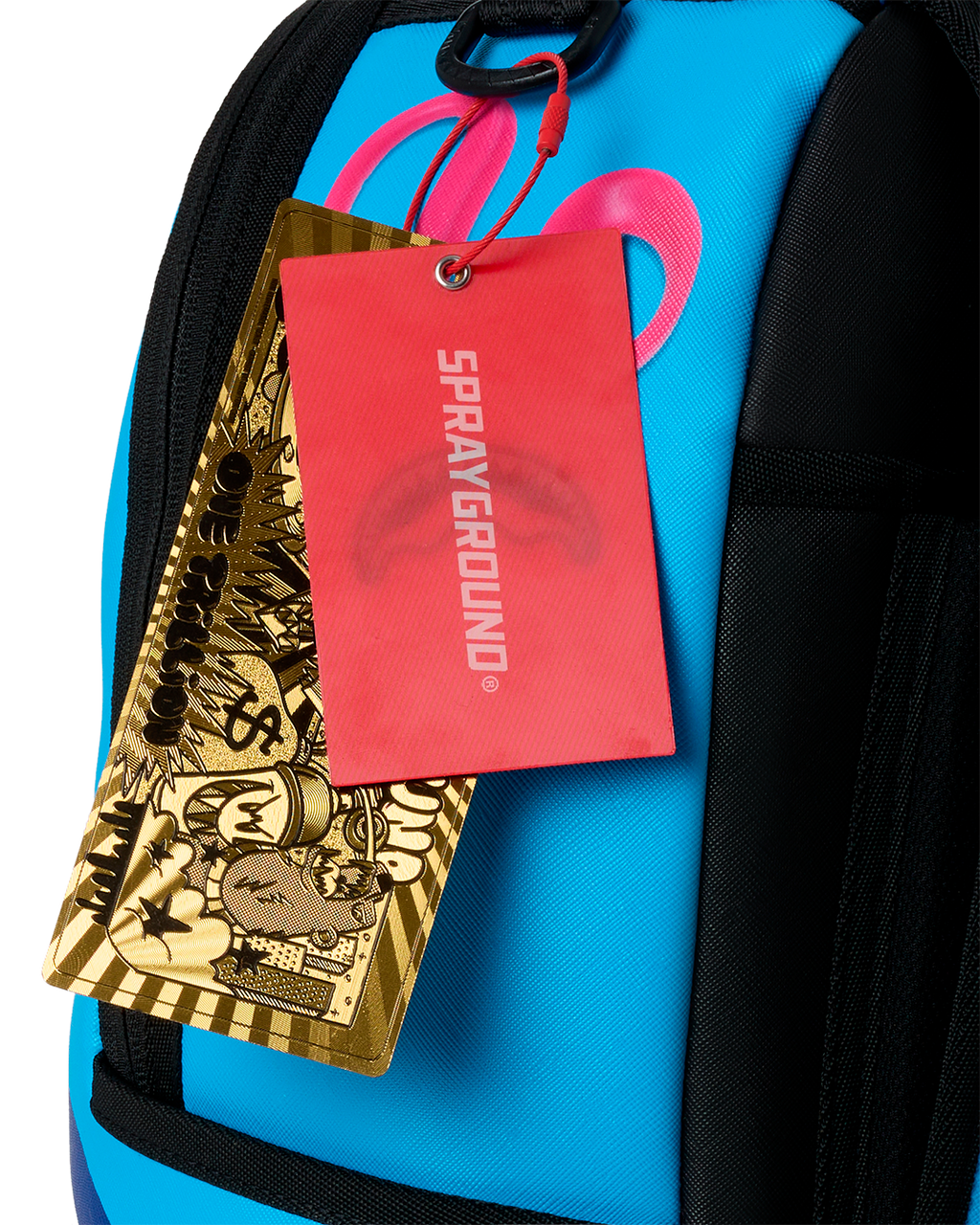 Sprayground backpack in bright blue with black straps and front zipper, showing hanging tags