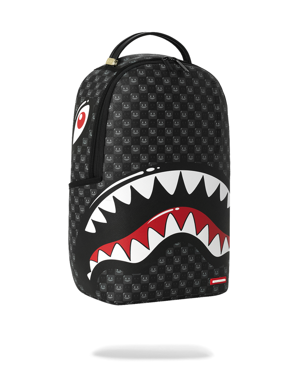 Sprayground shark-mouth backpack bag, black with red/white teeth graphic, angled front view