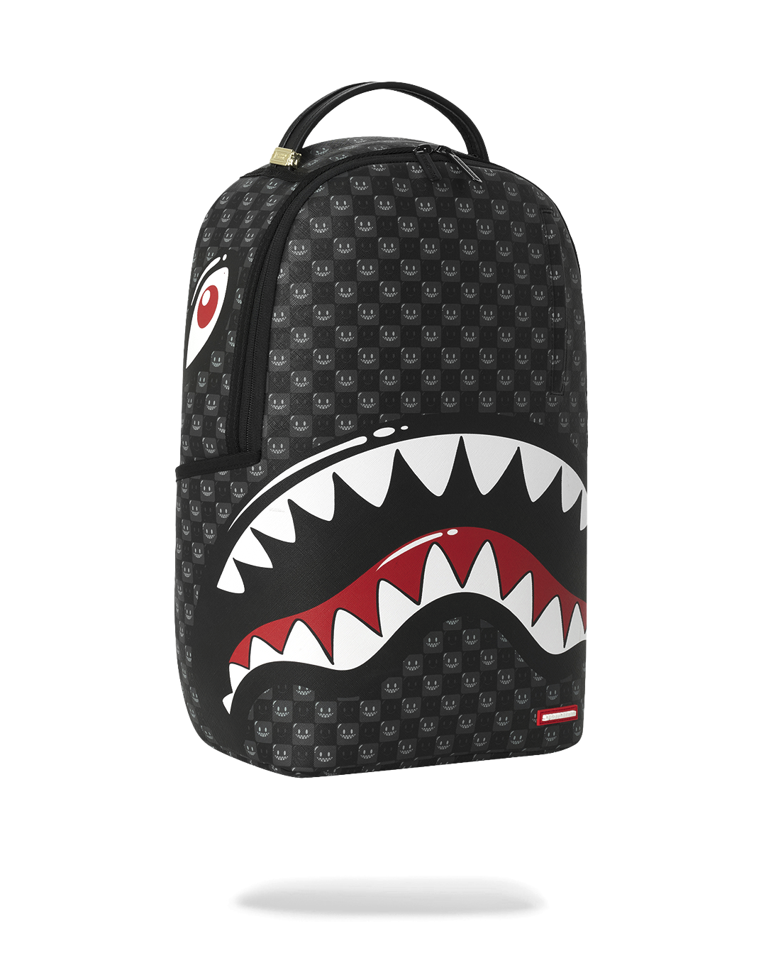 Sprayground shark-mouth backpack bag, black with red/white teeth graphic, angled front view