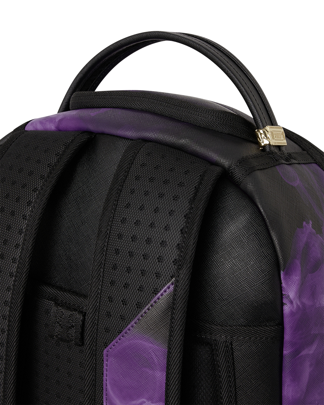 Purple-and-black backpack bag close-up of textured front panel and strap area