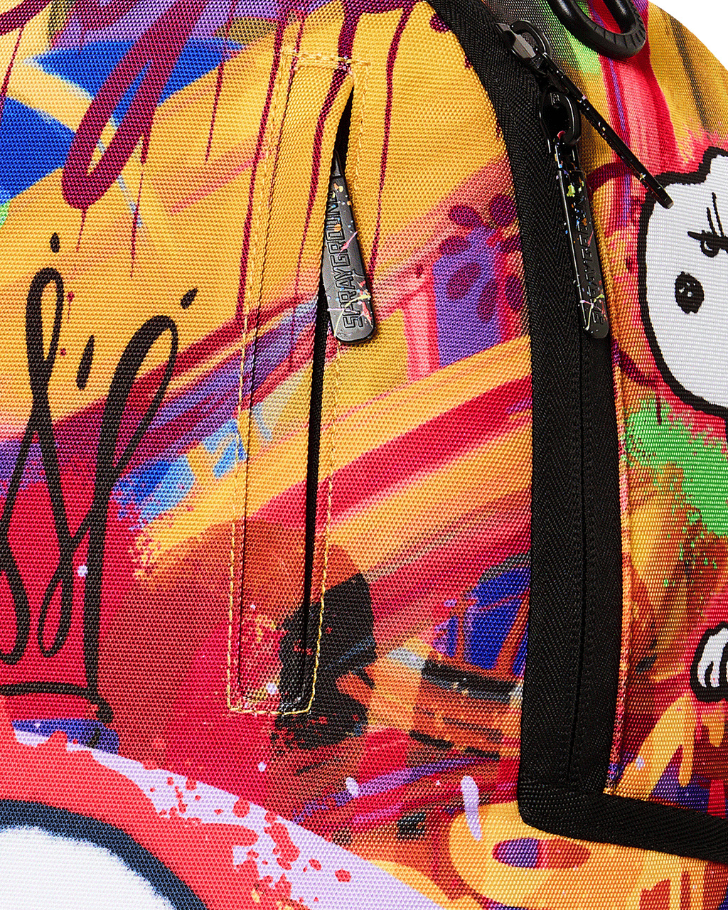Close-up of zipper pull and side pocket on colorful Snoopy backpack with black trim