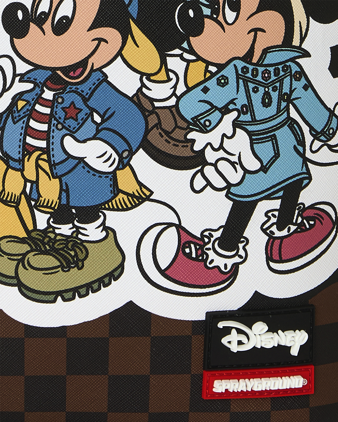 Backpack front with Disney and Sprayground patches on Mickey artwork