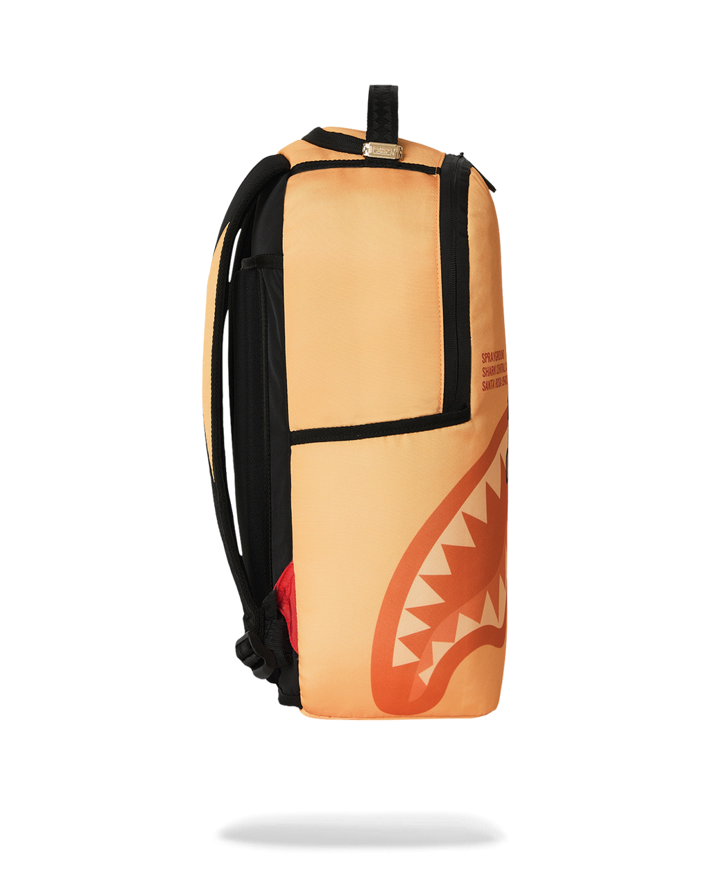 Sprayground Peanuts Franklin backpack, orange and black side with top handle loop