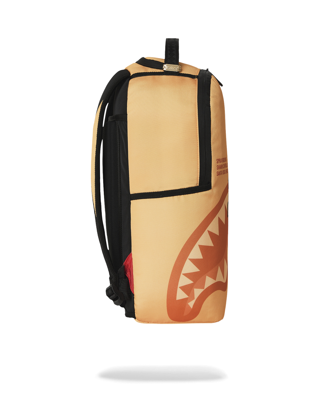 Sprayground Peanuts Franklin backpack, orange and black side with top handle loop