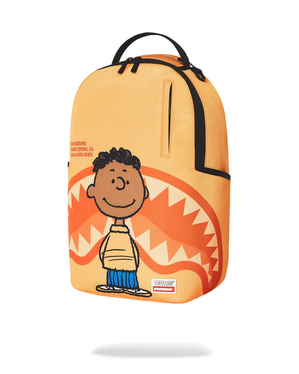 Sprayground Peanuts Franklin backpack, orange front with smiling character and zipper pull
