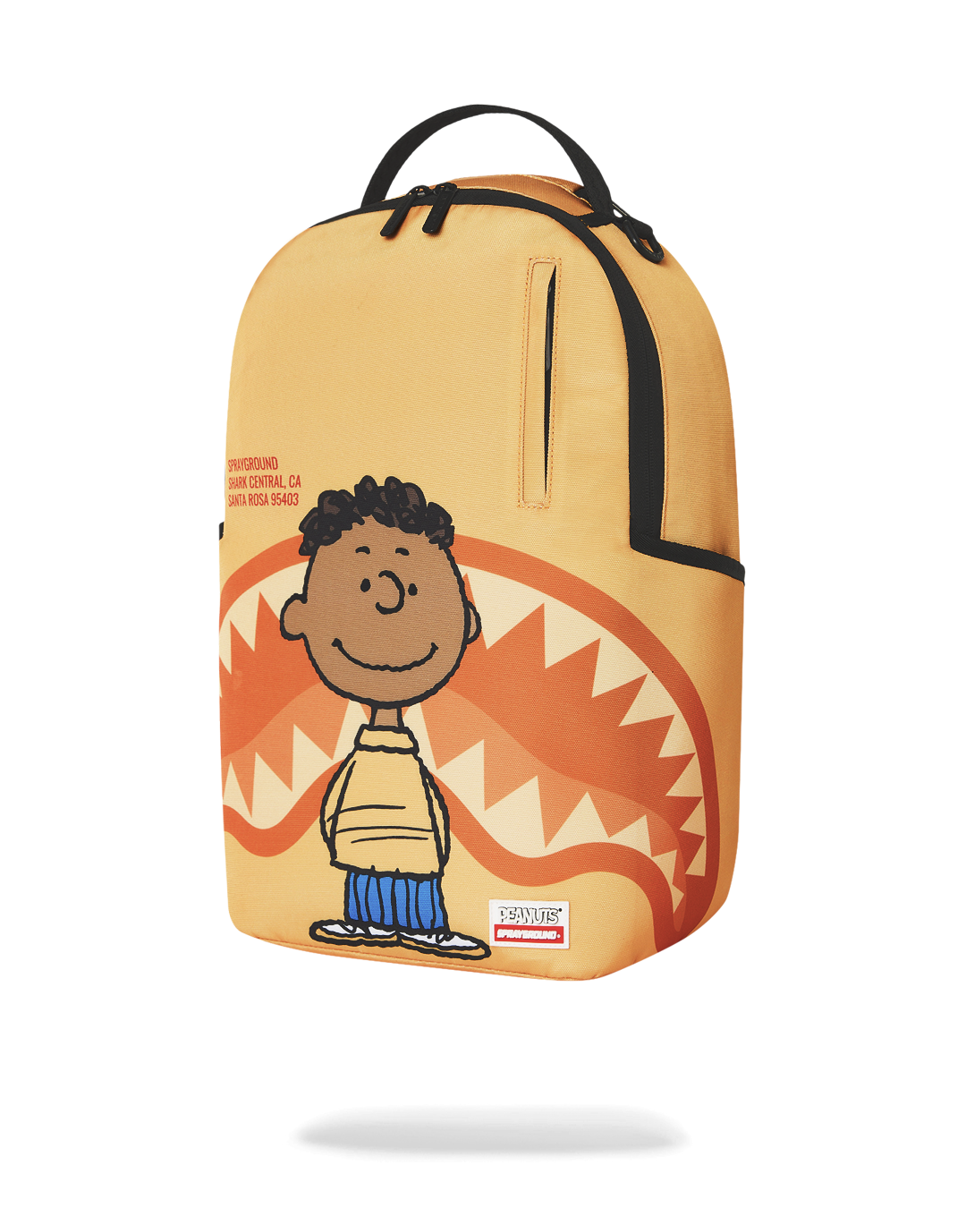 Sprayground Peanuts Franklin backpack, orange front with smiling character and zipper pull