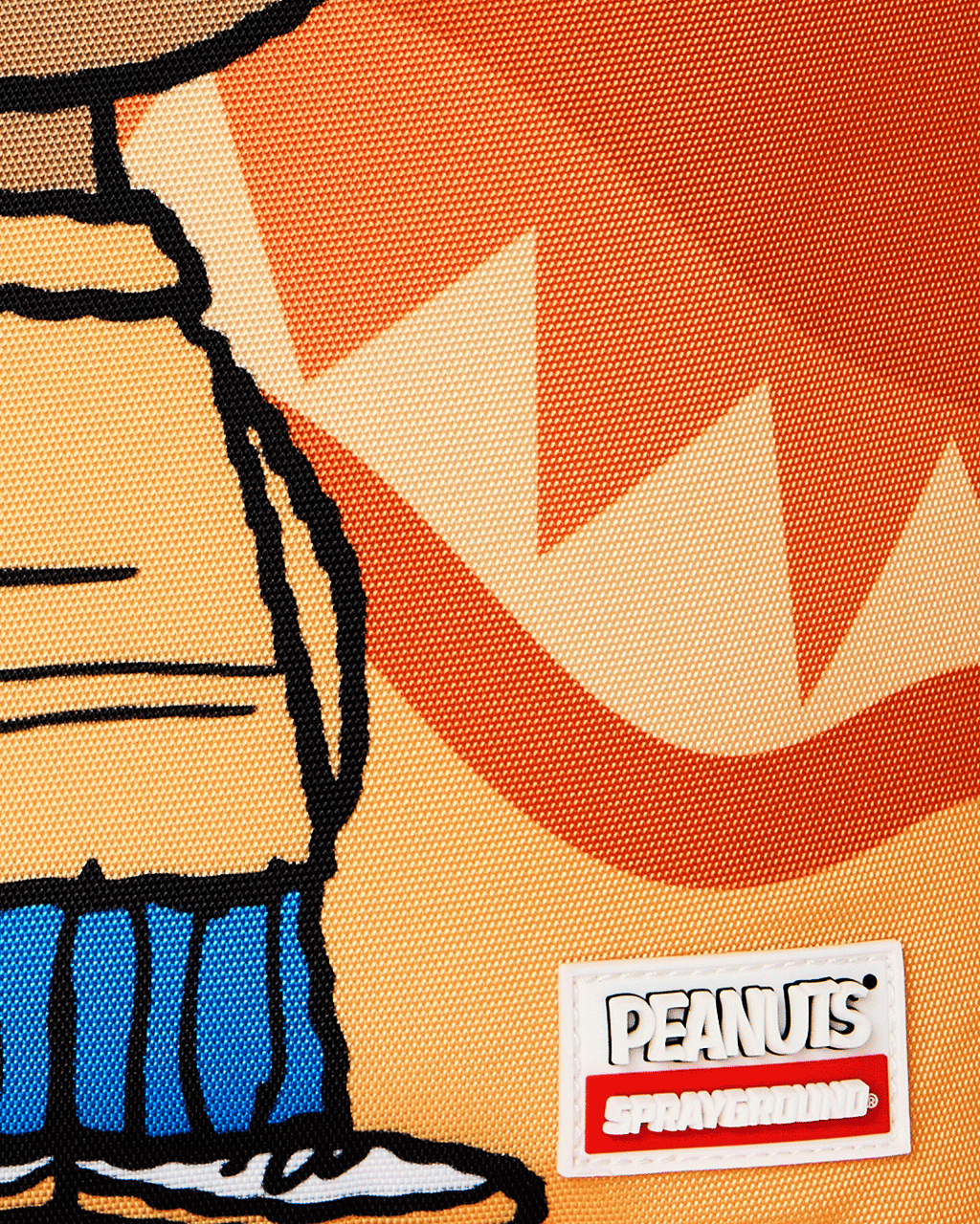 Sprayground Peanuts Franklin backpack, PEANUTS logo label on orange graphic fabric