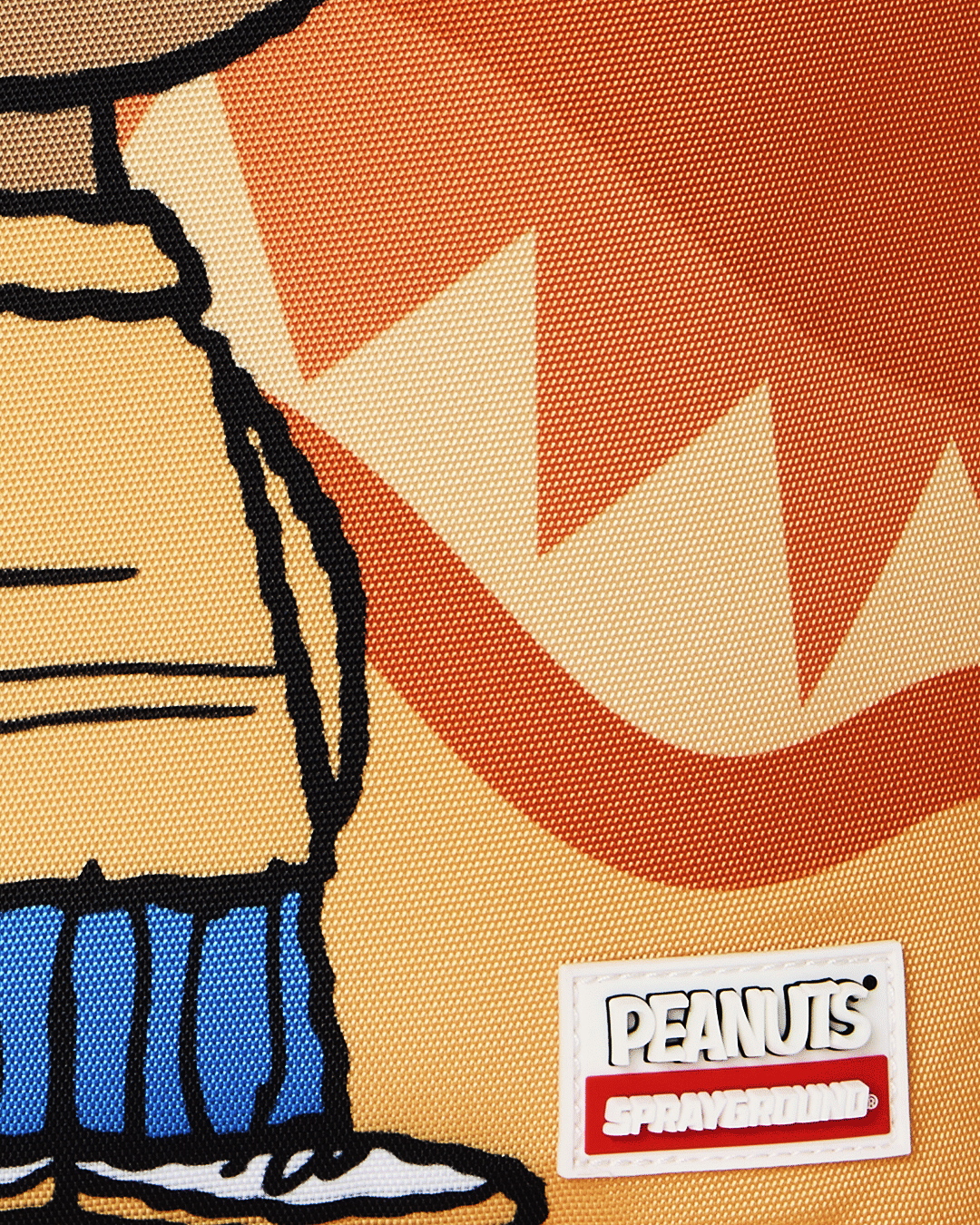 Sprayground Peanuts Franklin backpack, PEANUTS logo label on orange graphic fabric