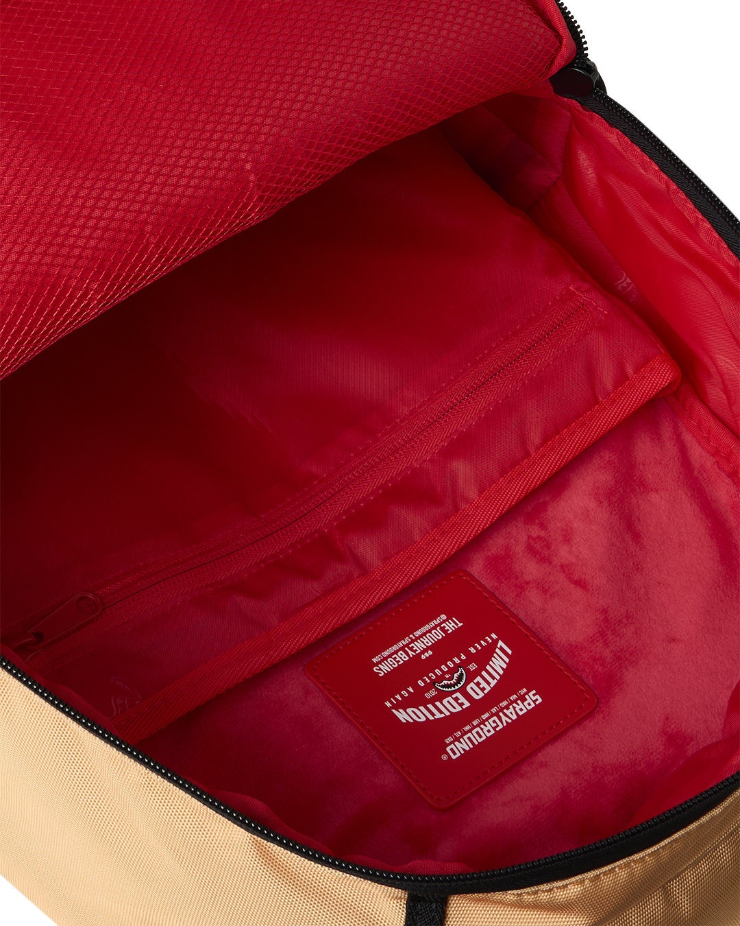 Sprayground Peanuts Franklin backpack interior, red lining with zipped pocket